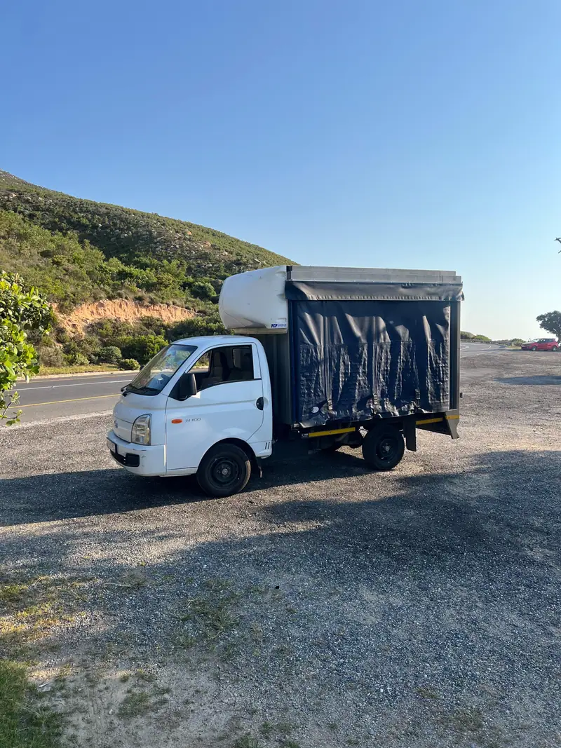 Terrific Loads truck parked beside a coastal road